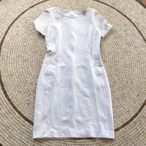 White fitted dress with white leather sleeves